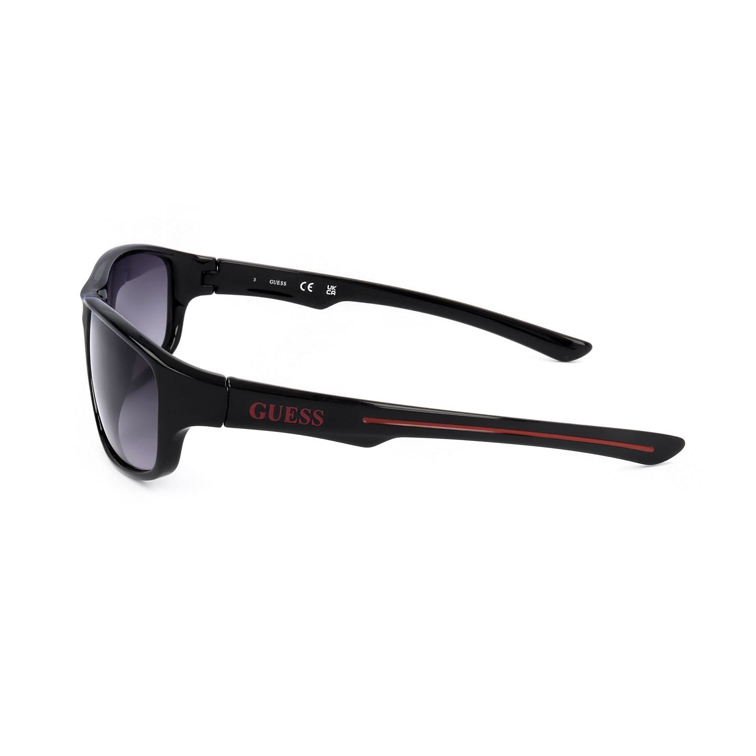 Occhiali da sole Guess neri con dettagli rossi e lenti sfumate.