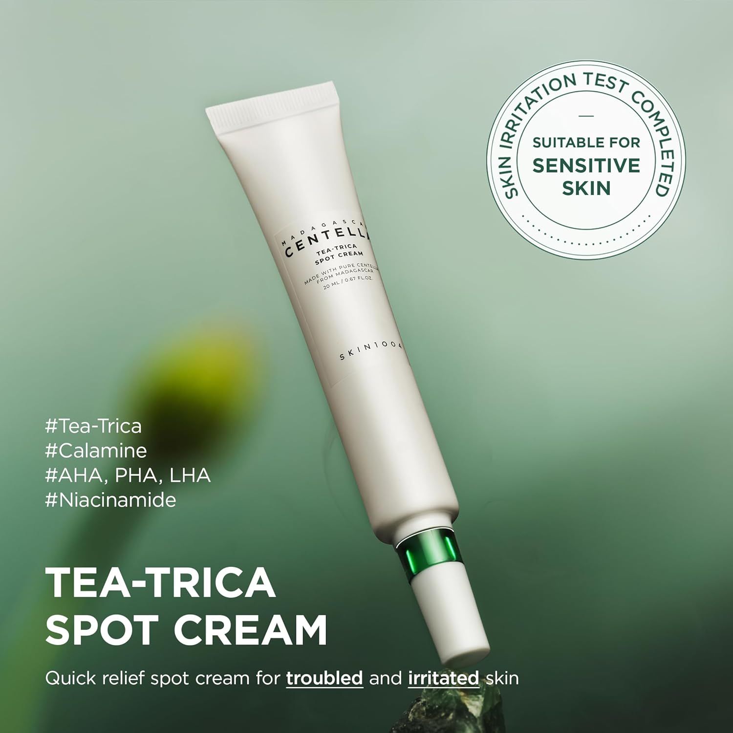 Tubo bianco con tappo verde. Scritta: Tea-Trica Spot Cream. Sul tubo c'è scritto SKIN1004. Adatto alle pelli sensibili.
