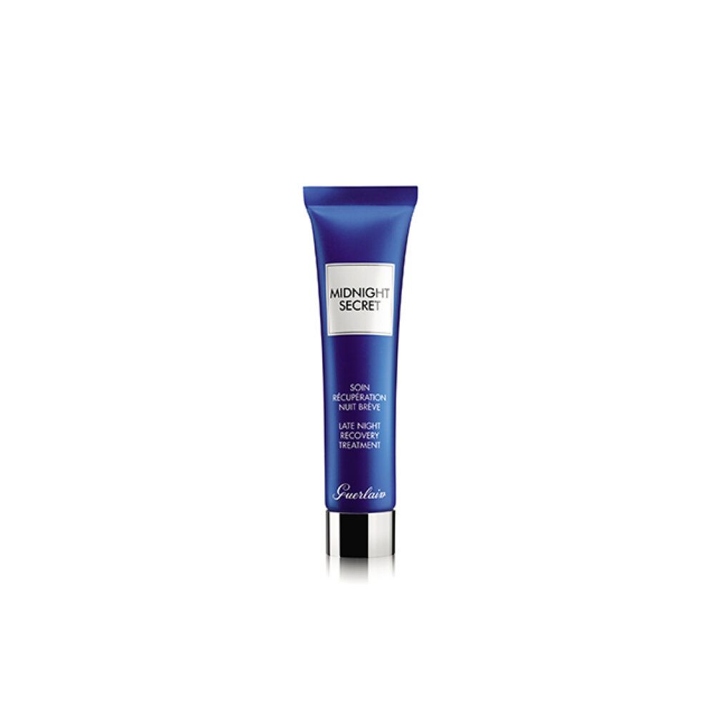 Tubo blu con etichetta bianca. Scritte: MIDNIGHT SECRET, SOIN RÉCUPÉRATION NUIT BRÈVE, LATE NIGHT RECOVERY TREATMENT. Chiusura argentata.