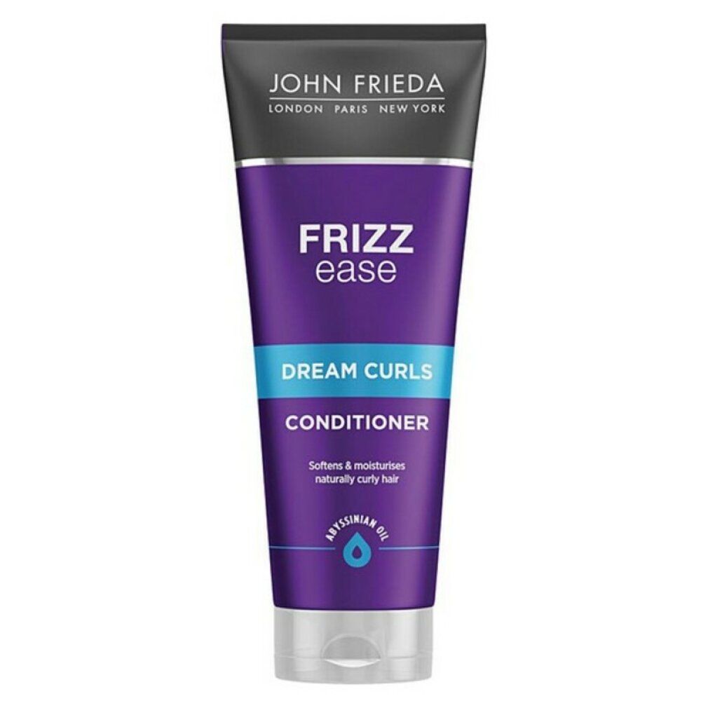 Conditioner John Frieda Frizz Ease Dream Curls. Tubo viola con testo blu. Contiene olio di Abissinia. Testo: Dream Curls, Conditioner.