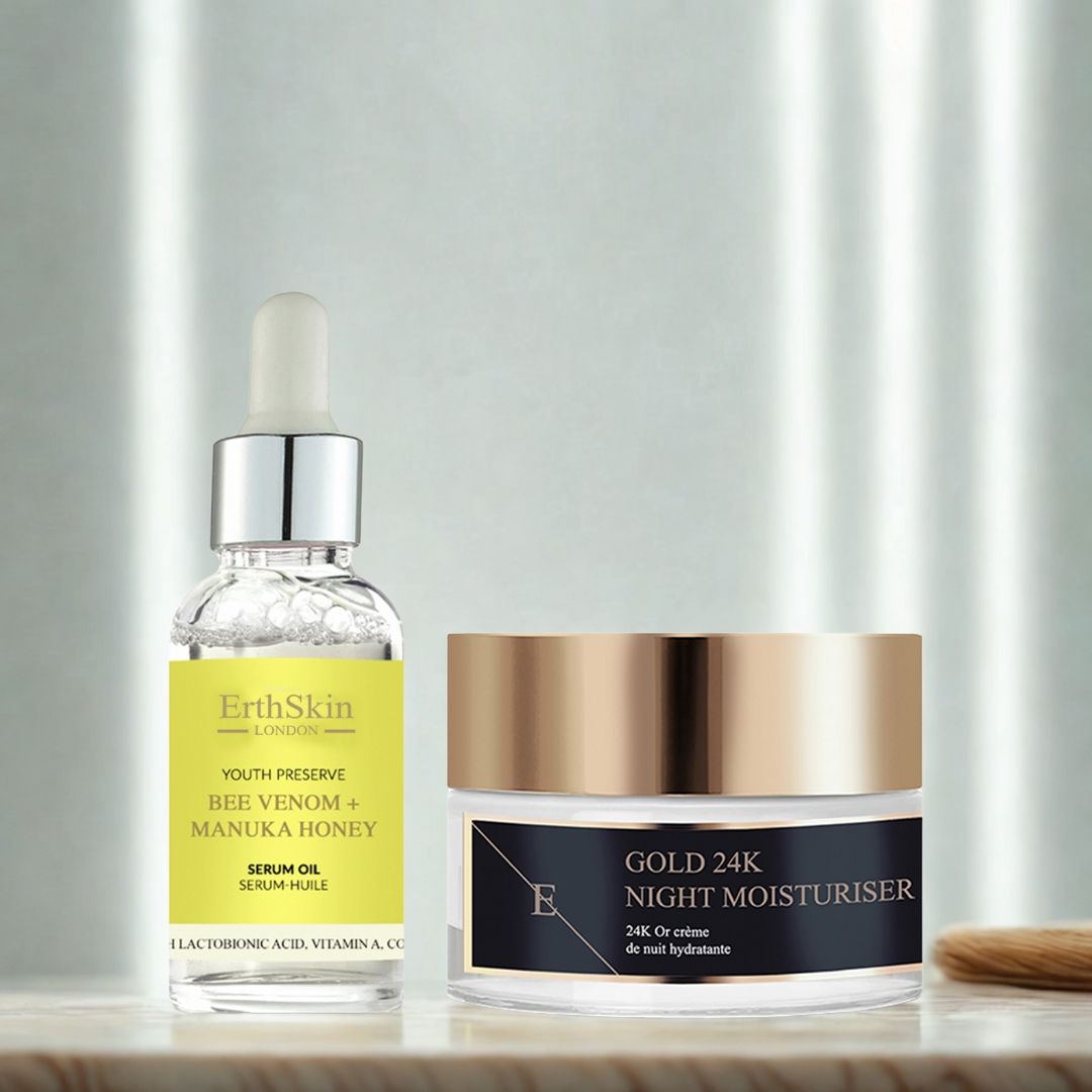 Flacone di siero e vasetto di crema. Siero con pipetta, etichetta gialla. Vasetto di crema con coperchio dorato. Scritta: Gold 24K Night Moisturiser. Pennello.