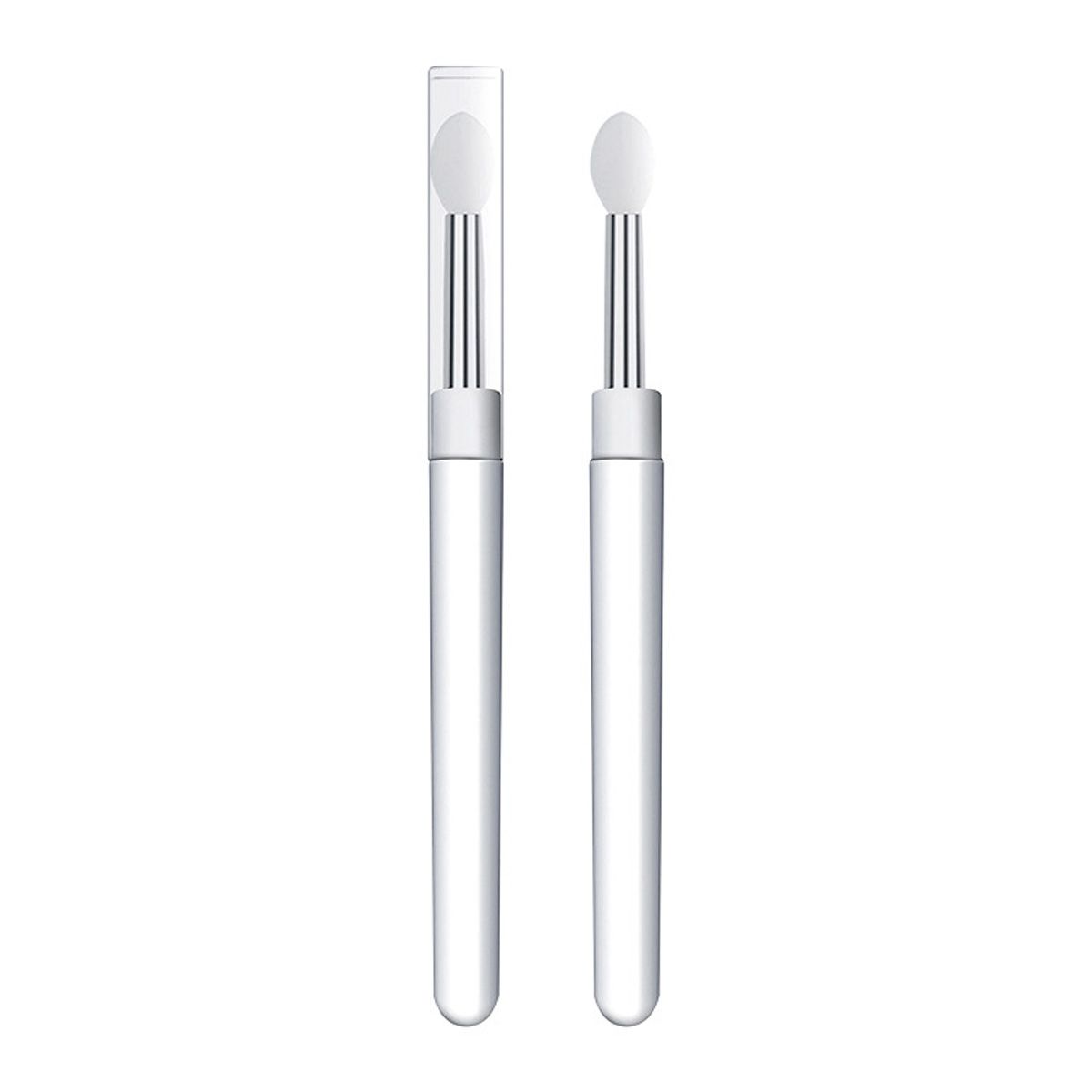 Due applicatori con manico trasparente e punta in silicone bianco, uno con cappuccio protettivo.