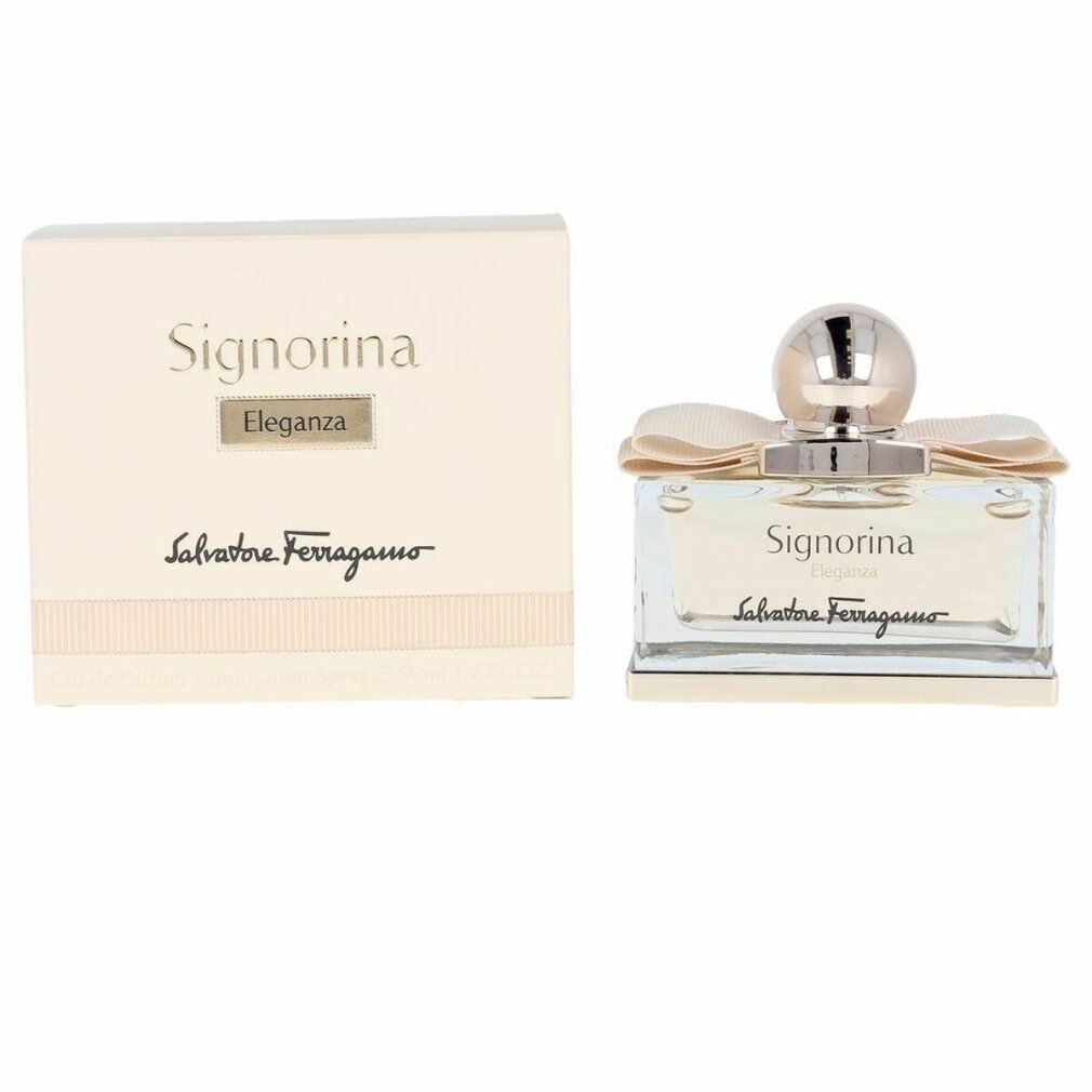 Scatola rettangolare beige e flacone. Scritta: Signorina Eleganza, Salvatore Ferragamo. Flacone con fiocco.