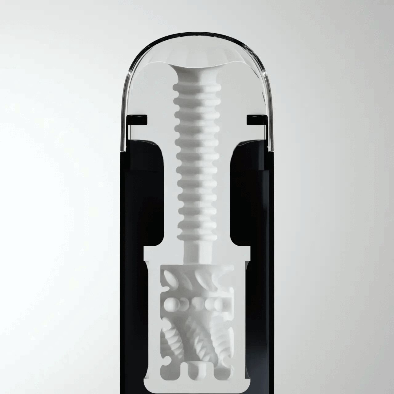 Sezione trasversale di un dispositivo nero con interno bianco. Si vede una struttura a vite e una camera strutturata.