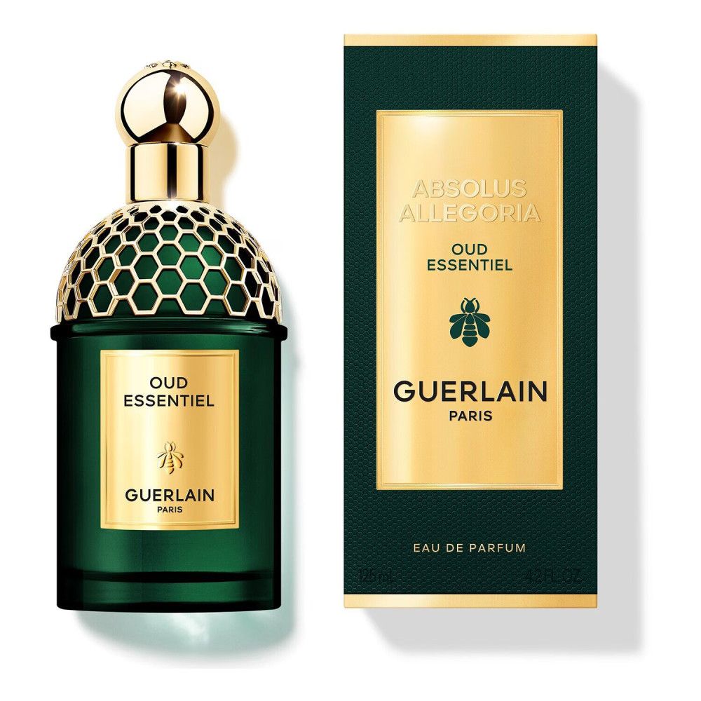 Flacone di profumo verde e scatola. Tappo dorato, testo dorato. Sulla scatola: "Absolus Allegoria Oud Essentiel" e "Guerlain Paris".