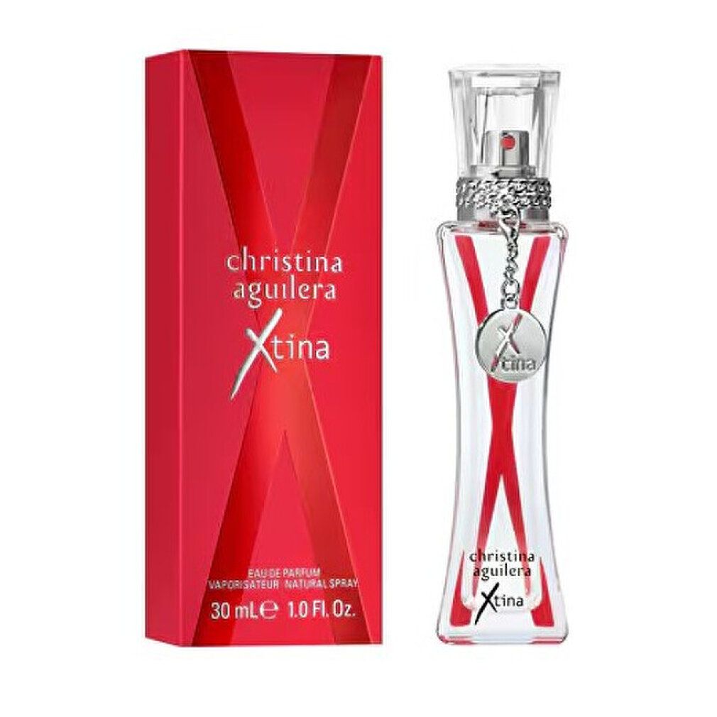 Profumo rosso con confezione rossa. Scritta: Christina Aguilera Xtina. Flacone con forma a X rossa e ciondolo.