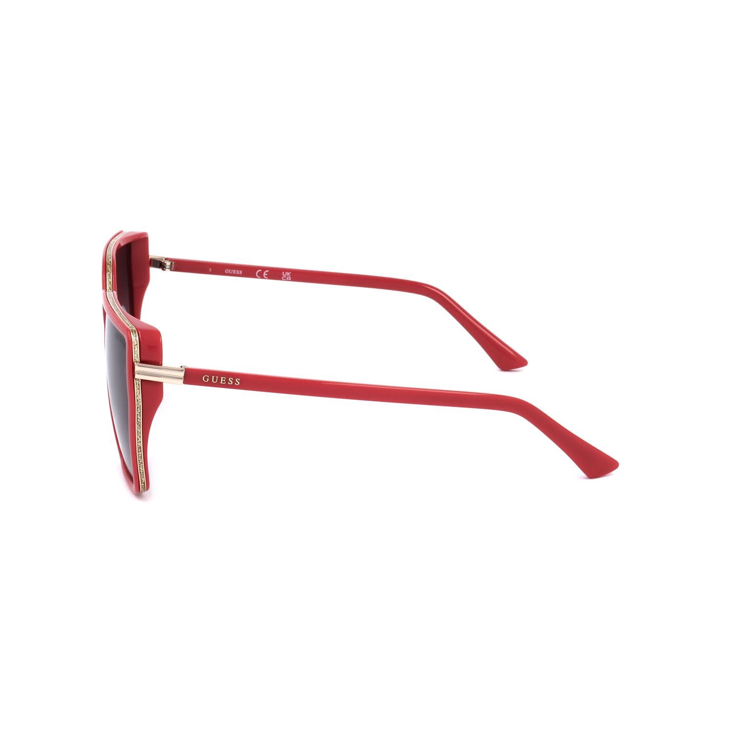 Occhiali da sole Guess rossi con accenti dorati, vista laterale.