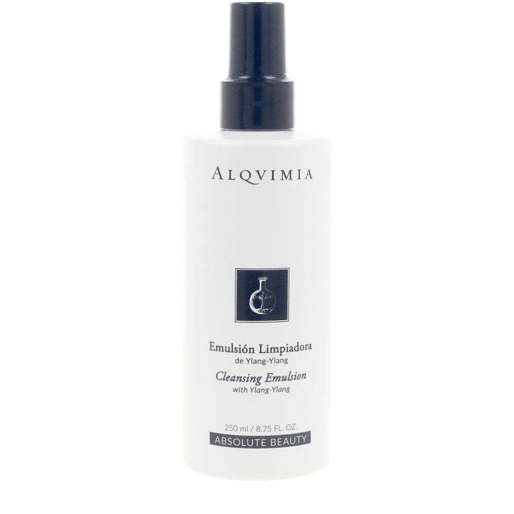 Flacone bianco con vaporizzatore blu. Scritta: "ALQVIMIA", "Emulsión Limpiadora de Ylang-Ylang", "Cleansing Emulsion".