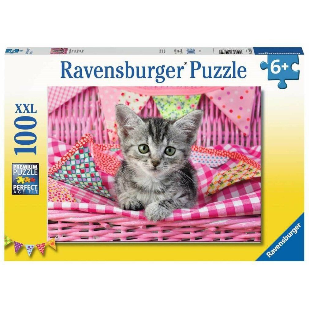 Puzzle Ravensburger con gattino. 100 pezzi XXL. Confezione con immagine del prodotto. Età consigliata 6+. Cesto rosa, ghirlanda.