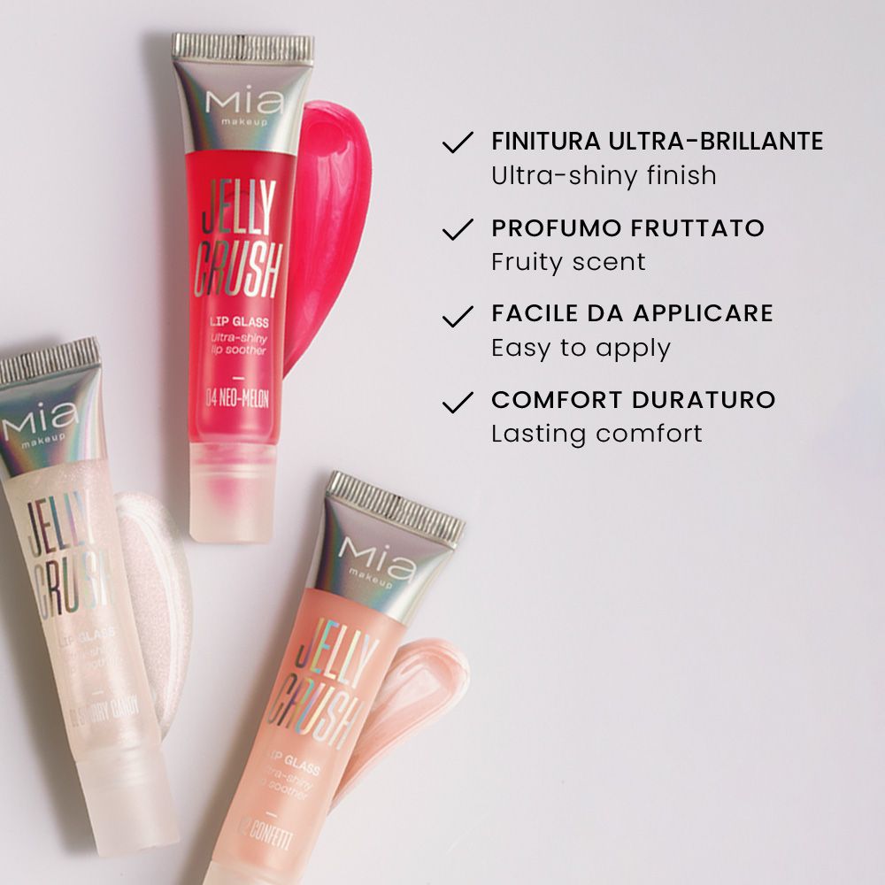 Tre tubetti di lucidalabbra Mia Make-up Jelly Crush. I prodotti sono nei colori 04 Neo-Melon, 02 Confetti e un altro colore non completamente visibile. Sulla destra è visibile un campione di lucidalabbra rosa.