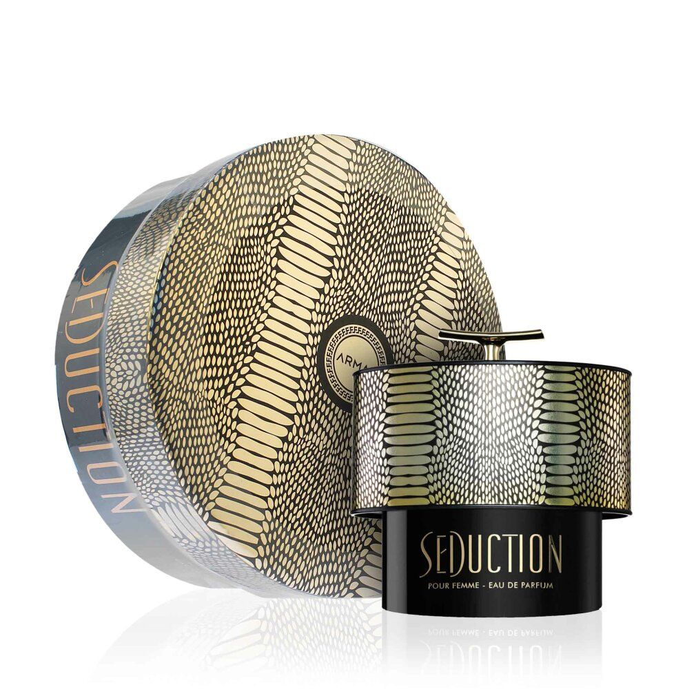 Flacone di profumo e confezione. Flacone con coperchio dorato e motivo a serpente. Confezione rotonda con lo stesso motivo.