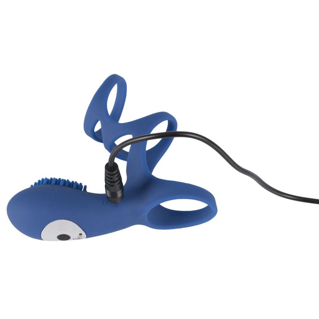 Anello blu con nodi, collegato a un cavo di ricarica. Per uso intimo.