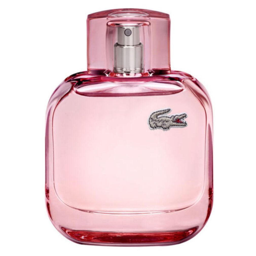 Flacone rosa con vaporizzatore. Logo Lacoste. Forma quadrata con bordi arrotondati. Tappo trasparente.