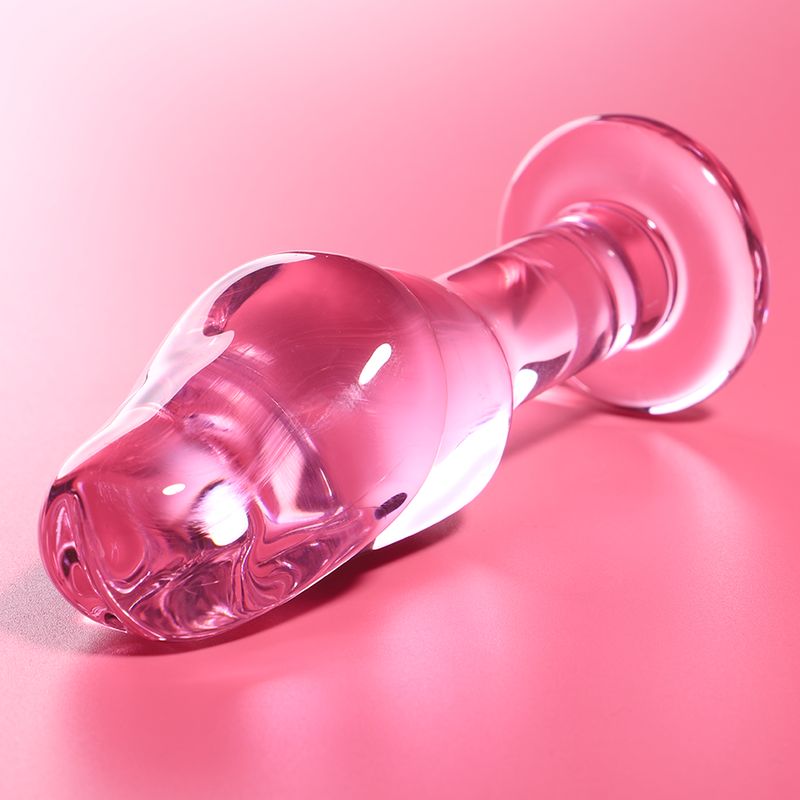 Plug in vetro rosa con base larga e forma ergonomica.