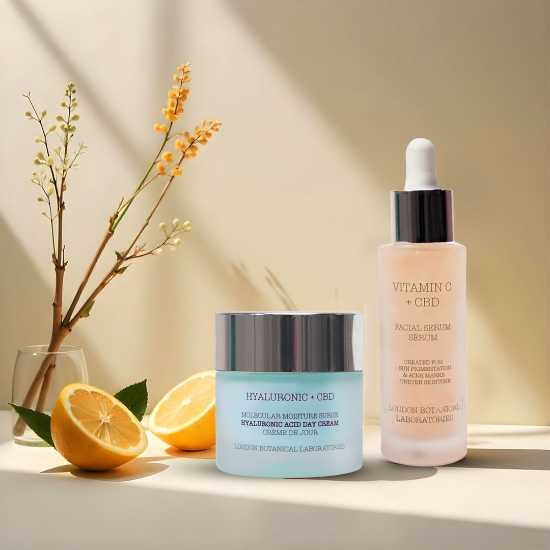 Crema e siero con limone e ramo. Scritte: Hyaluronic + CBD, Vitamin C + CBD.
