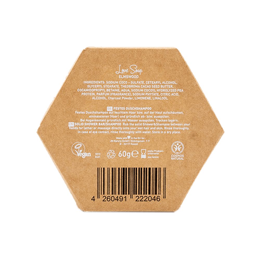 Sapone esagonale in confezione. Retro con ingredienti, codice a barre e logo vegano. Testo: Festes Duschshampoo.