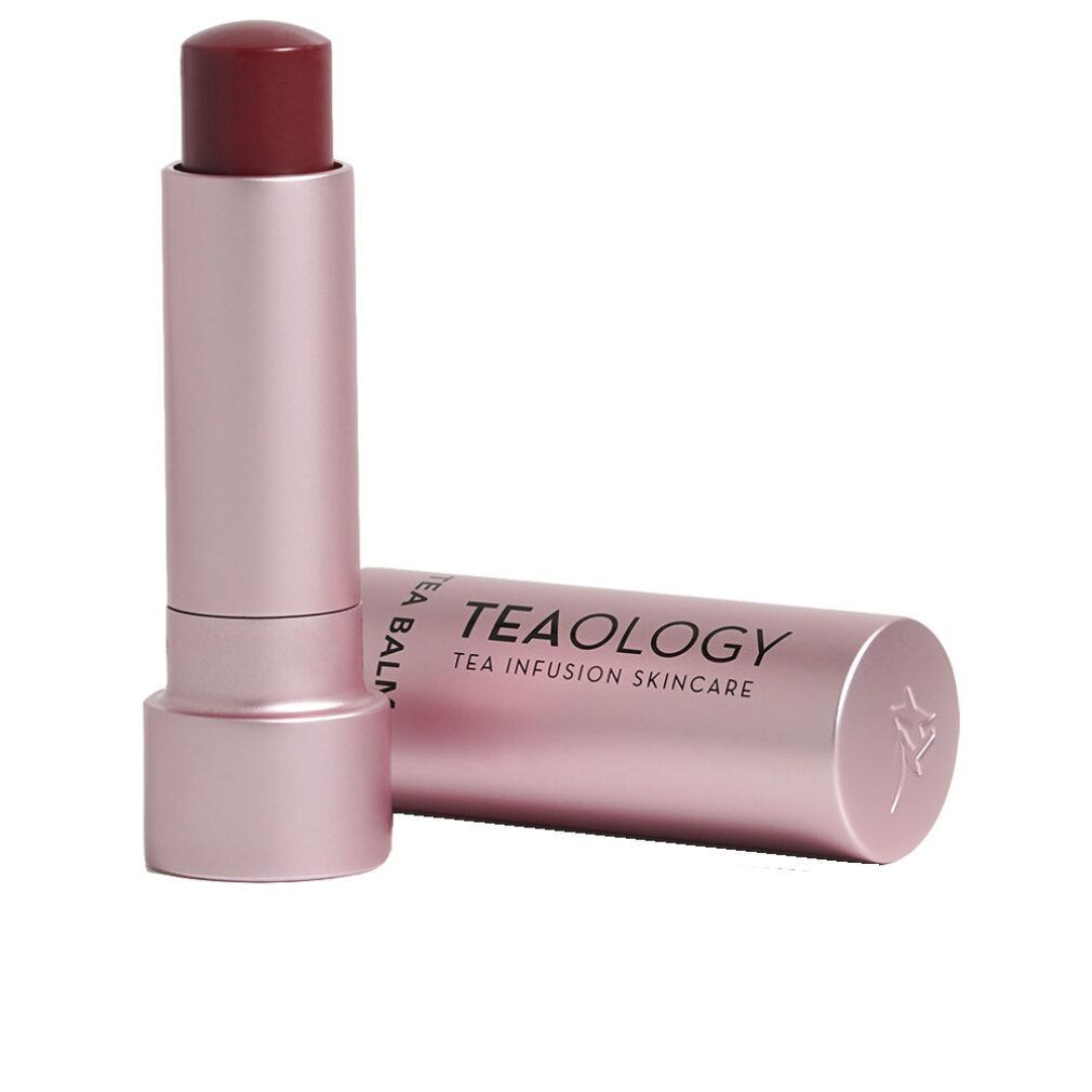 Balsamo per labbra in astuccio rosa. Coperchio accanto. Sul coperchio: "TEA BALM" e "TEA INFUSION SKINCARE".