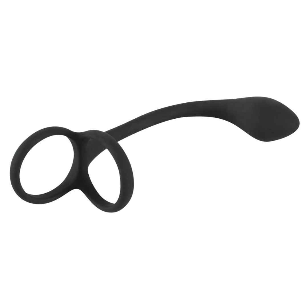Anello per pene/testicoli nero con plug anale. Parte ad anello con due aperture, collegata a un'asta curva e un'estremità a goccia.