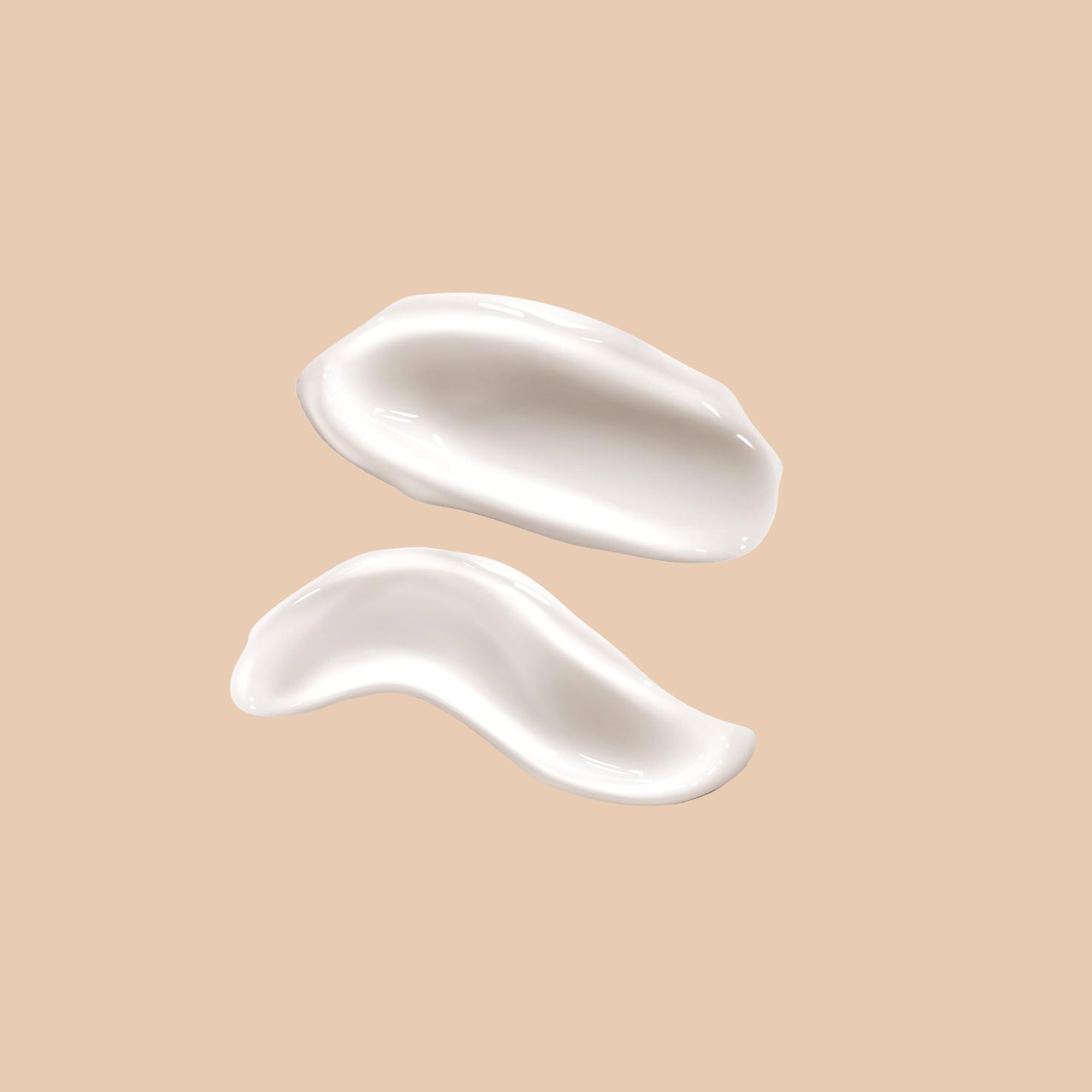 Due strisce di prodotto color crema su sfondo beige. La consistenza è liscia e cremosa.