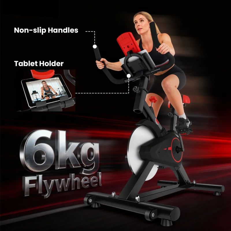 Bicicletta fitness con donna che si allena. Supporto per tablet e volano da 6 kg. Sfondo nero.