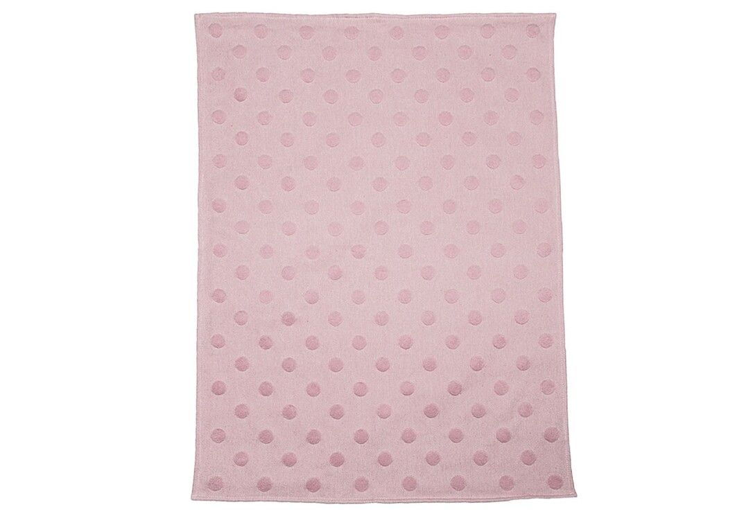 Coperta rosa con motivo a pois. Forma rettangolare. Materiale morbido.