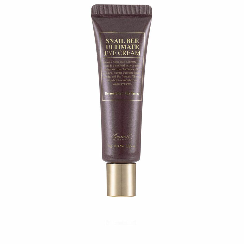 Tubo marrone con tappo dorato. Scritta: Snail Bee Ultimate Eye Cream. Testo e logo. Dermatologicamente testato.