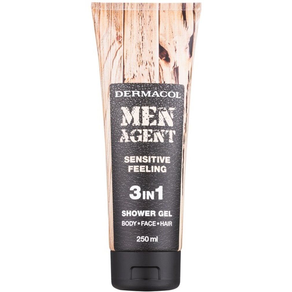 Tubo di gel doccia con motivo legno. Etichetta nera con "MEN AGENT", "SENSITIVE FEELING" e "3in1".