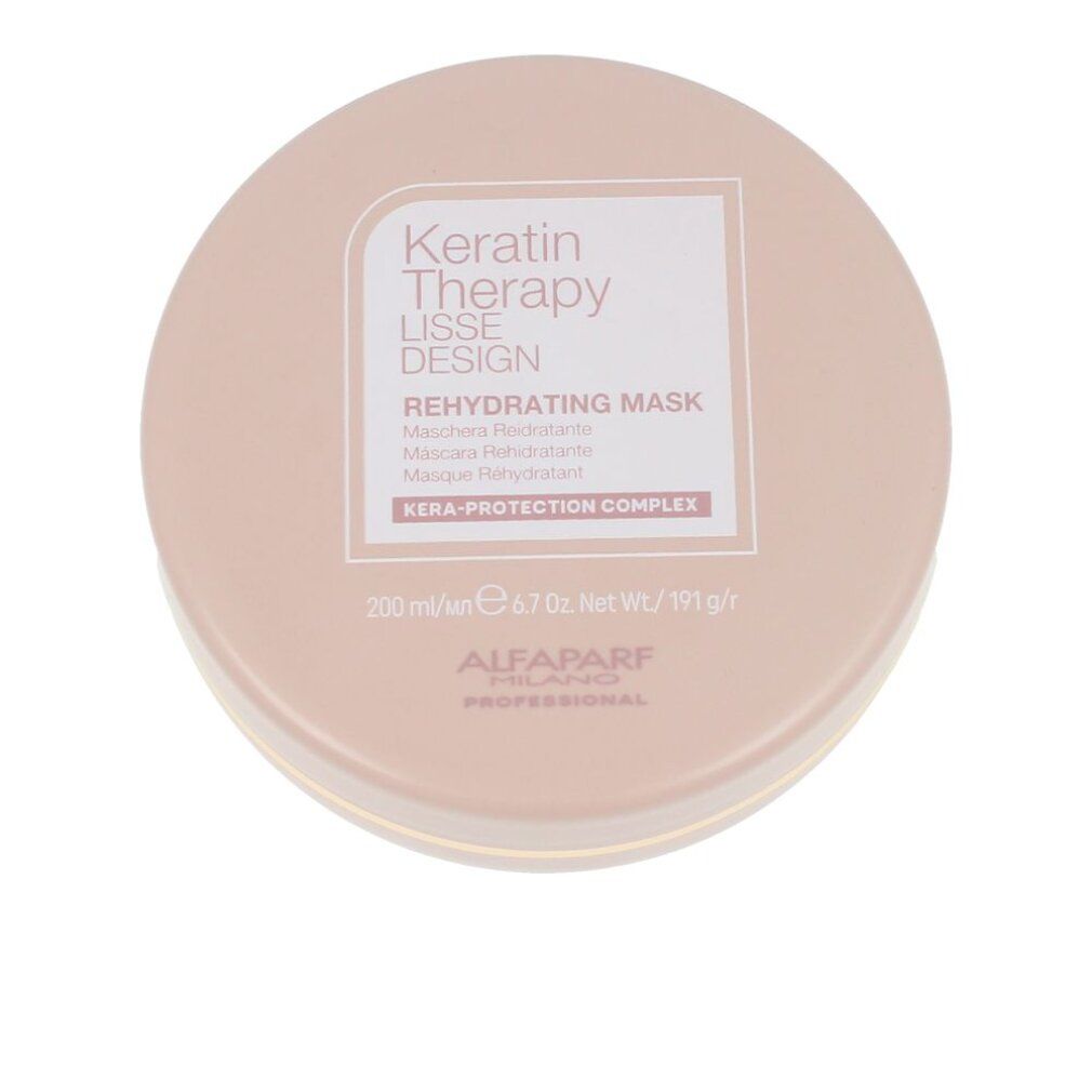 Barattolo rotondo rosa con bordo dorato. Scritta: Keratin Therapy Lisse Design Rehydrating Mask. Marchio: Alfaparf Milano Professional.