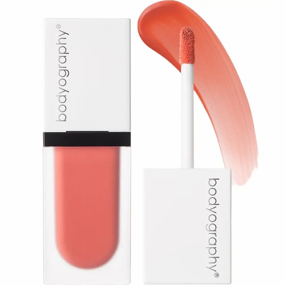 Flacone di fard liquido con applicatore. Flacone trasparente, tappo bianco. Marchio BODYOGRAPHY.