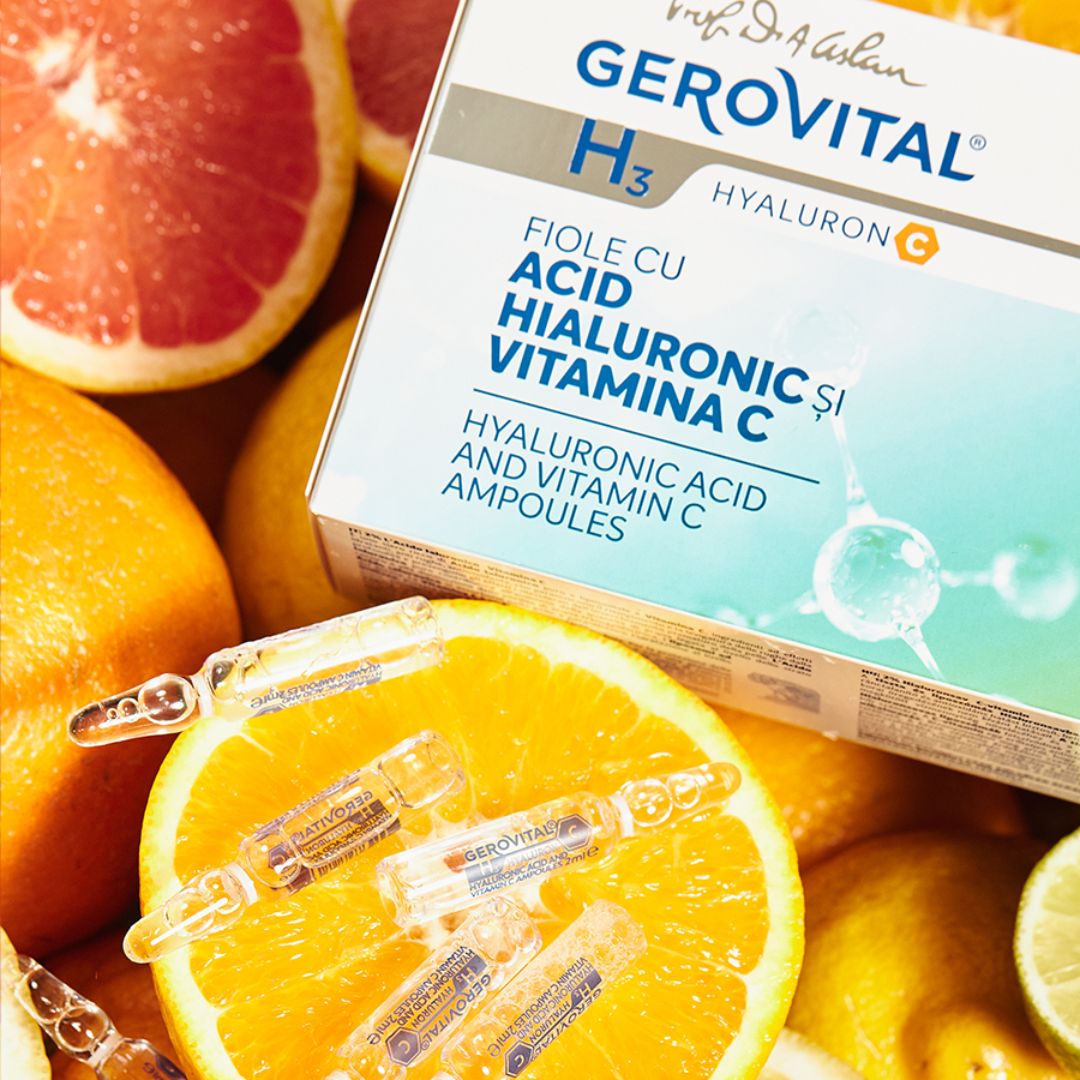 Fiale Gerovital con acido ialuronico 2% e vitamina C su arance e pompelmo.