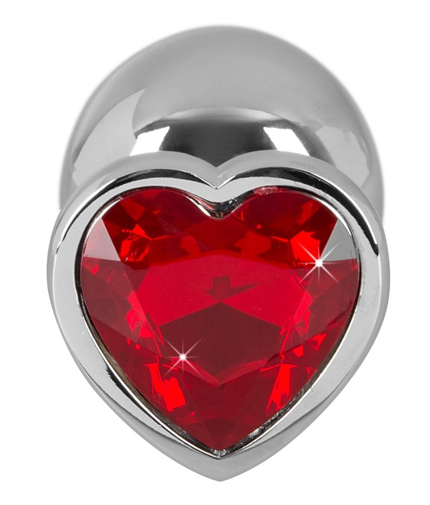 Primo piano dell'Anal Plug color argento con applicazione a cuore rossa.