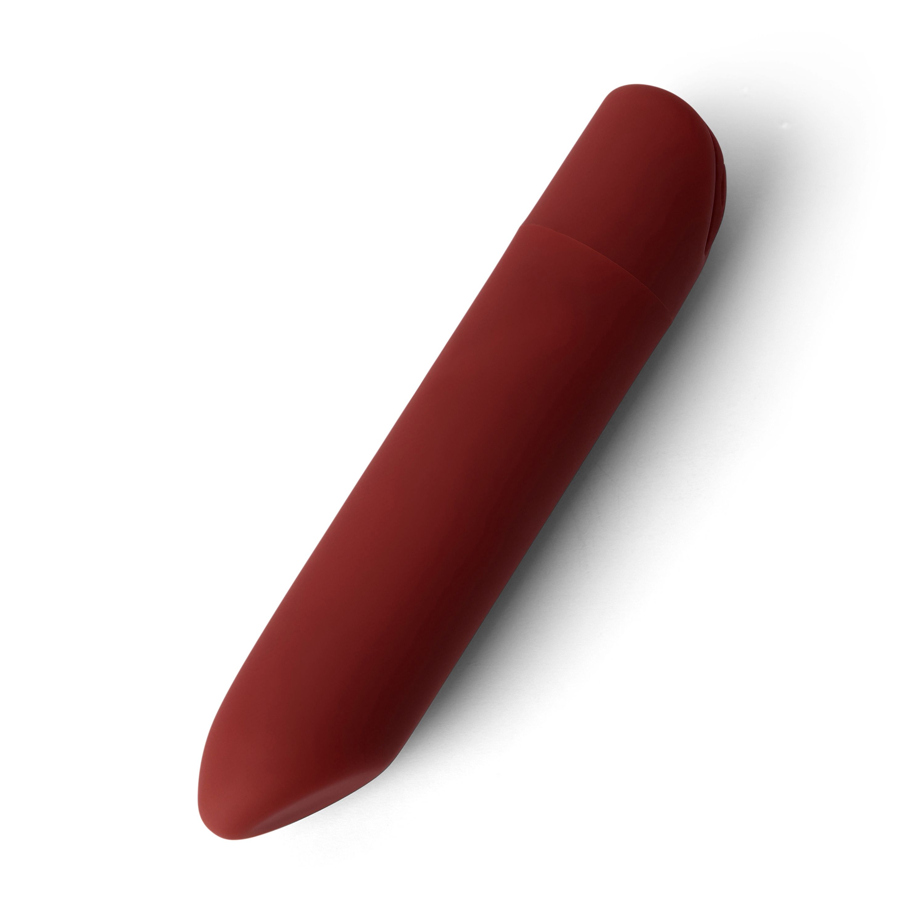 Oggetto allungato rosso, estremità arrotondate. Leggera rientranza sulla parte superiore. Su sfondo bianco.