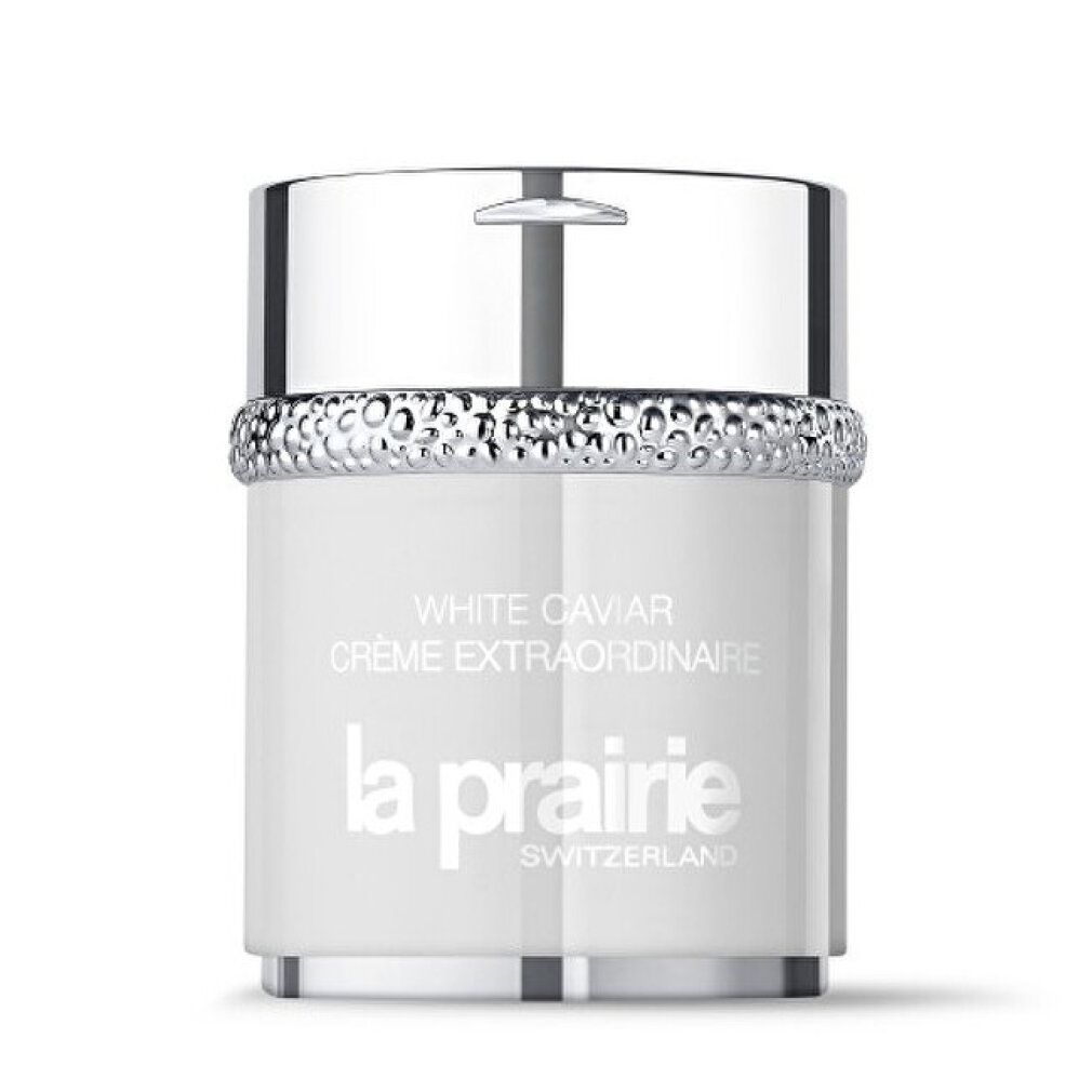 Vaso bianco con coperchio argentato. Testo: White Caviar Crème Extraordinaire, La Prairie, Switzerland. Anello di gioielli argentato.