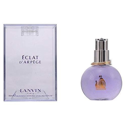 Flacone viola con vaporizzatore argentato e anello dorato. Confezione trasparente con scritta ÉCLAT D'ARPÈGE e LANVIN PARIS.