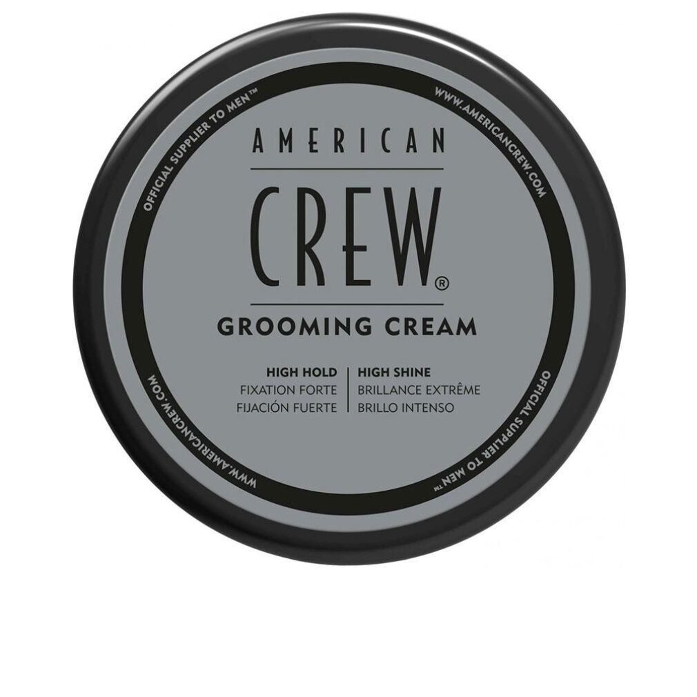 Vista dall'alto di un vasetto nero. "American Crew Grooming Cream" sul coperchio. Testo: High Hold, High Shine.