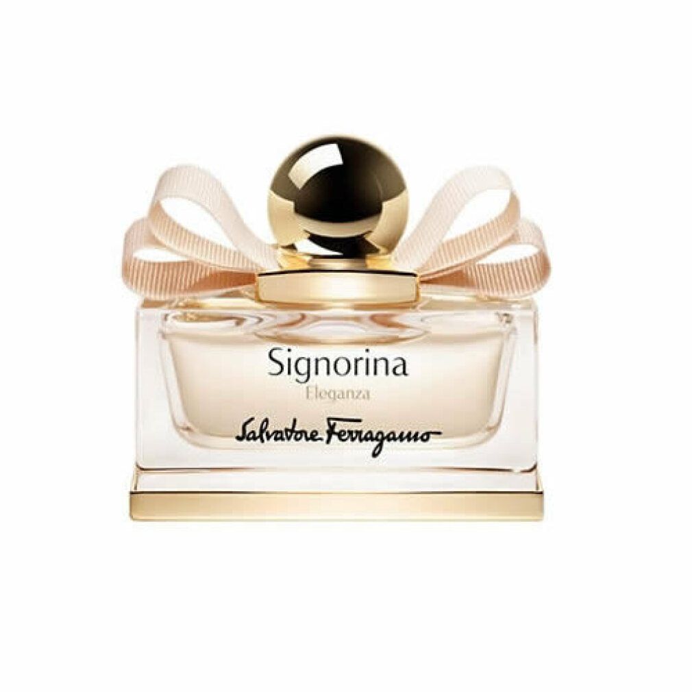 Flacone di profumo con tappo e fiocco dorati. Scritta: Signorina Eleganza, Salvatore Ferragamo.