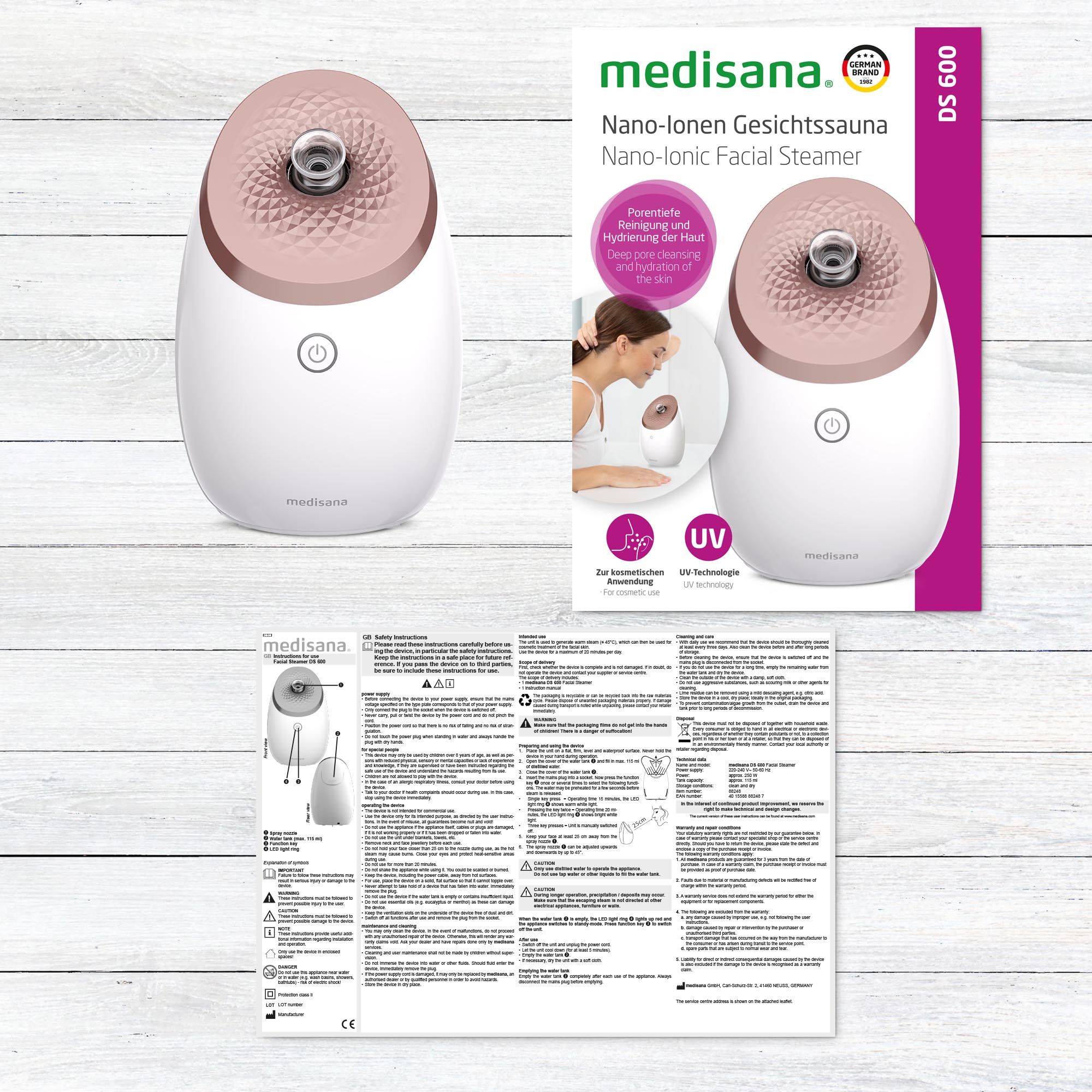 Sauna facciale con confezione e manuale. Dispositivo bianco con coperchio color oro rosa. Testo sulla confezione.