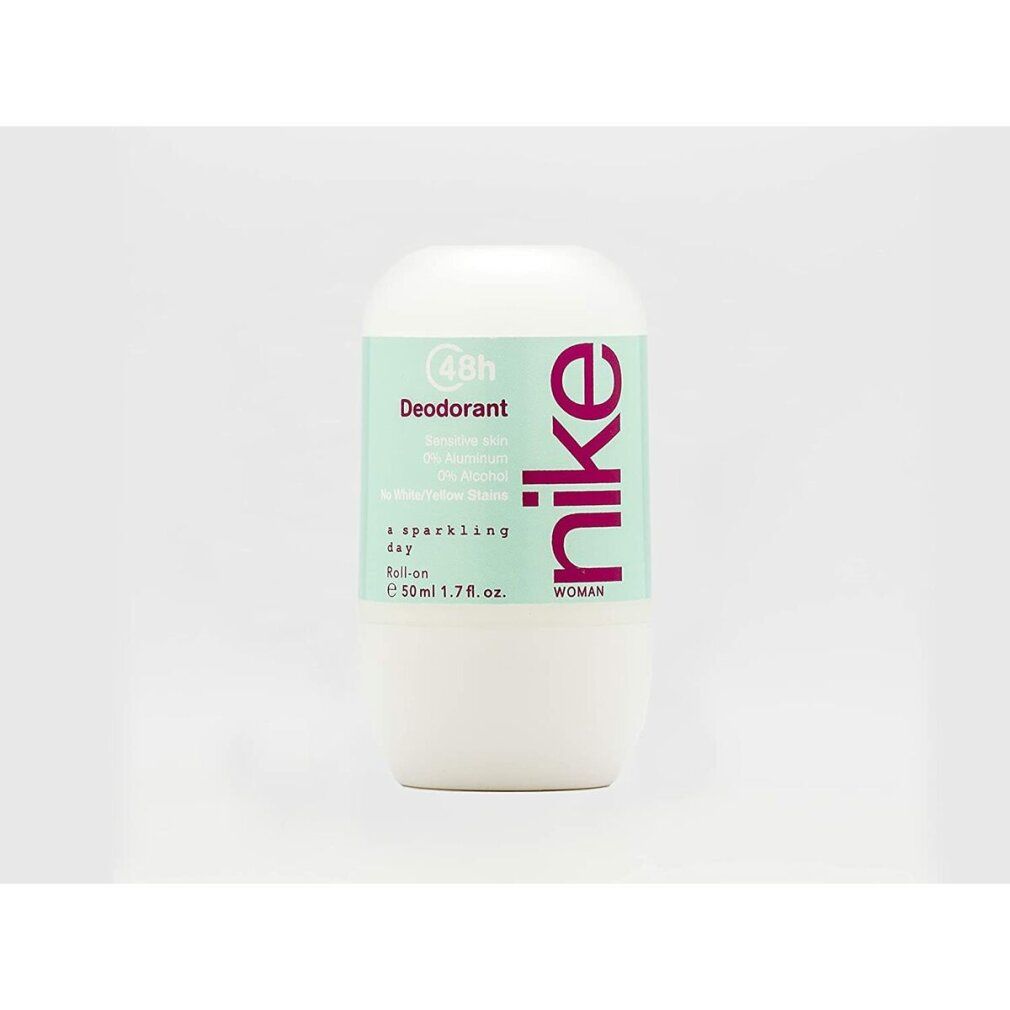 Deodorante roll-on. Contenitore bianco, etichetta turchese con logo Nike rosa. "a sparkling day". 50ml.