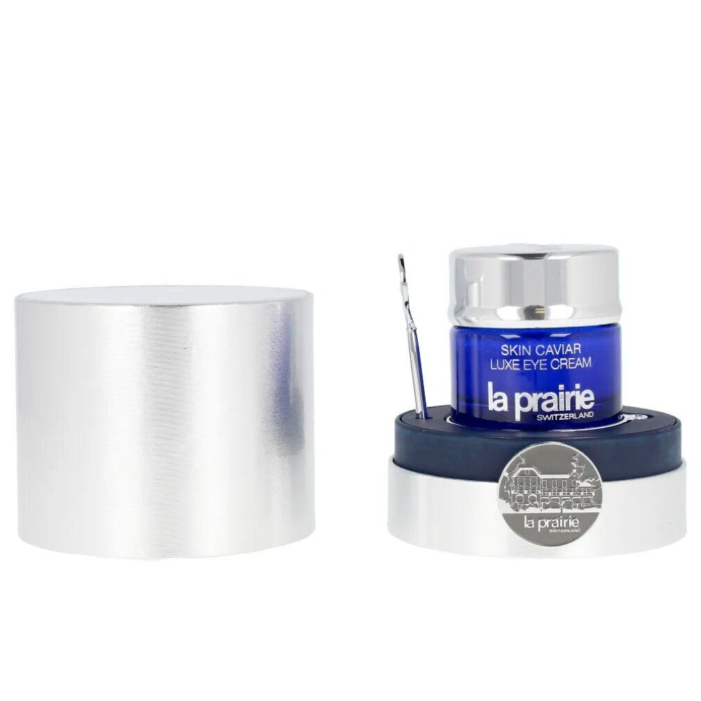 Vasetto blu con coperchio argentato e applicatore. Scritta: Skin Caviar Luxe Eye Cream, La Prairie.