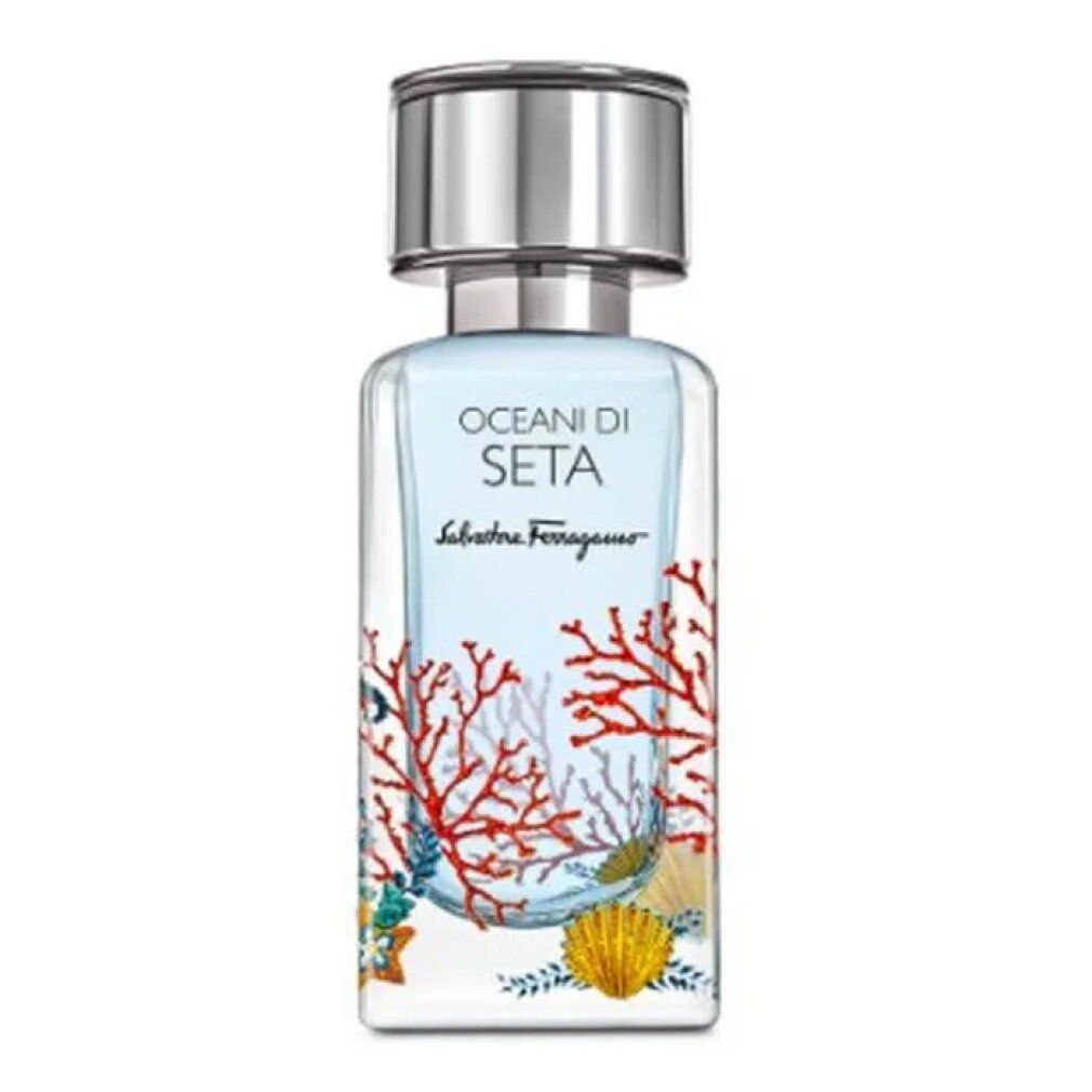 Flacone di profumo con tappo argentato. Scritta: Oceani Di Seta, Salvatore Ferragamo. Decorazioni coralli e conchiglie.