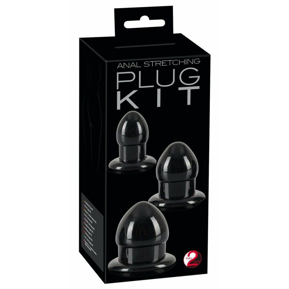 Set nero di tre plug anali in una scatola nera. Testo: ANAL STRETCHING PLUG KIT.