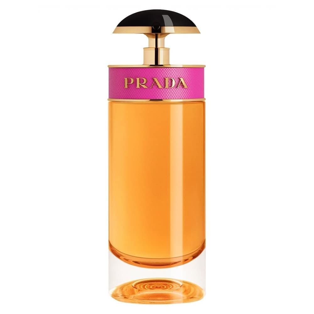 Flacone di profumo. Flacone cilindrico in vetro con fascia rosa e tappo nero. Scritta: Prada. Liquido ambrato.