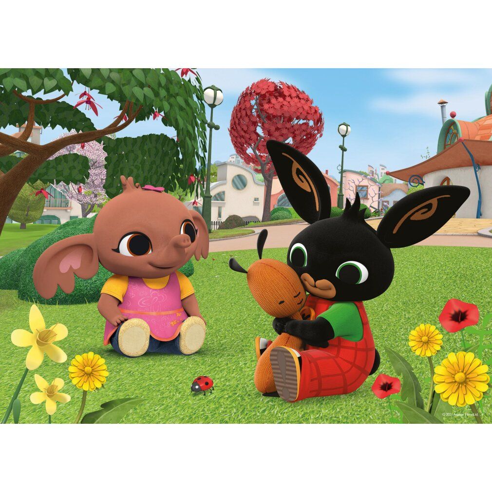 Personaggio di Bing con amici in un prato. Bing abbraccia un peluche. Fiori e una coccinella sono visibili.