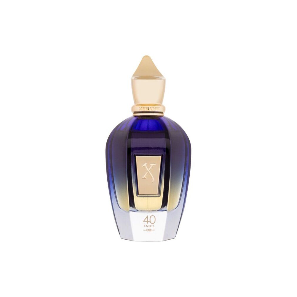 Flacone blu trasparente con tappo dorato. Etichetta dorata con 'X' e '40 Knots'.