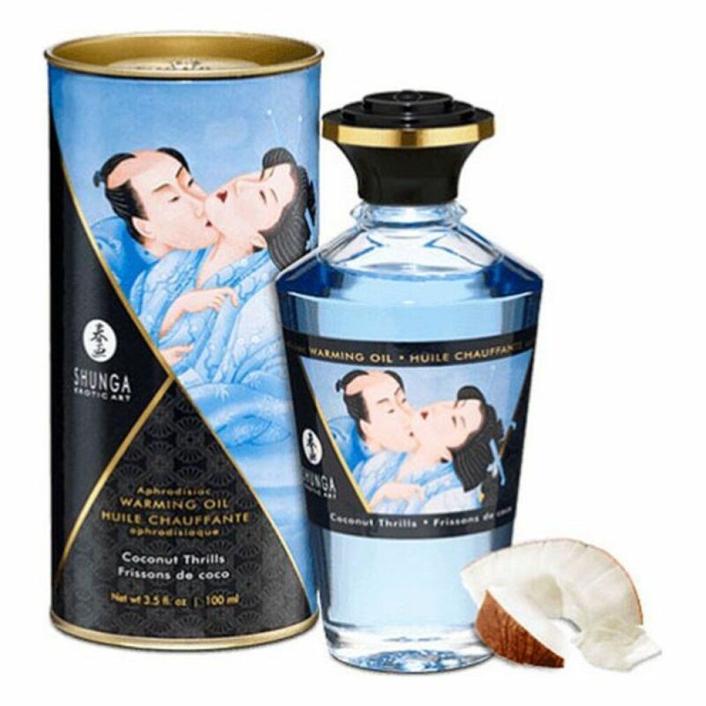 Flacone e scatola cilindrica blu. Scritta: Shunga, Warming Oil, Coconut Thrills. Pezzo di cocco.