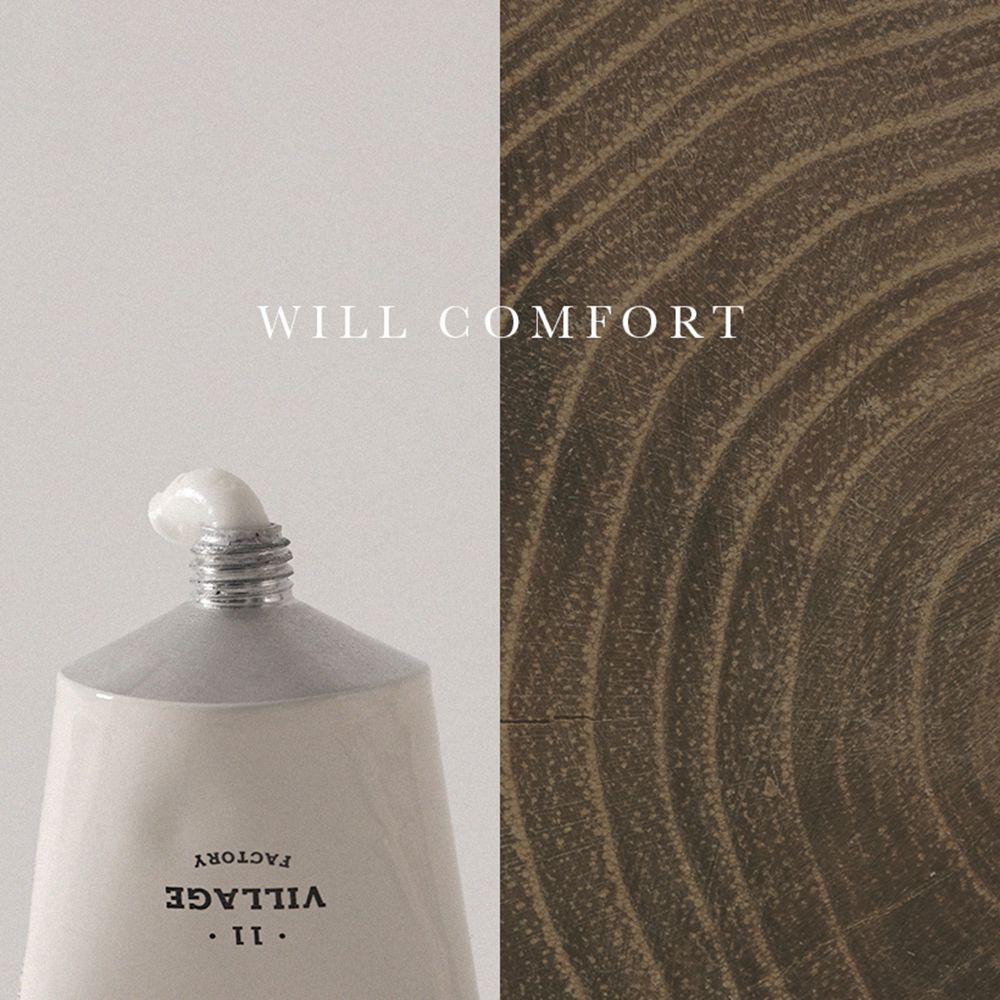Tubo di crema con nome del prodotto e testo. Scritta: WILL COMFORT, VILLAGE FACTORY. La crema esce dall'apertura.