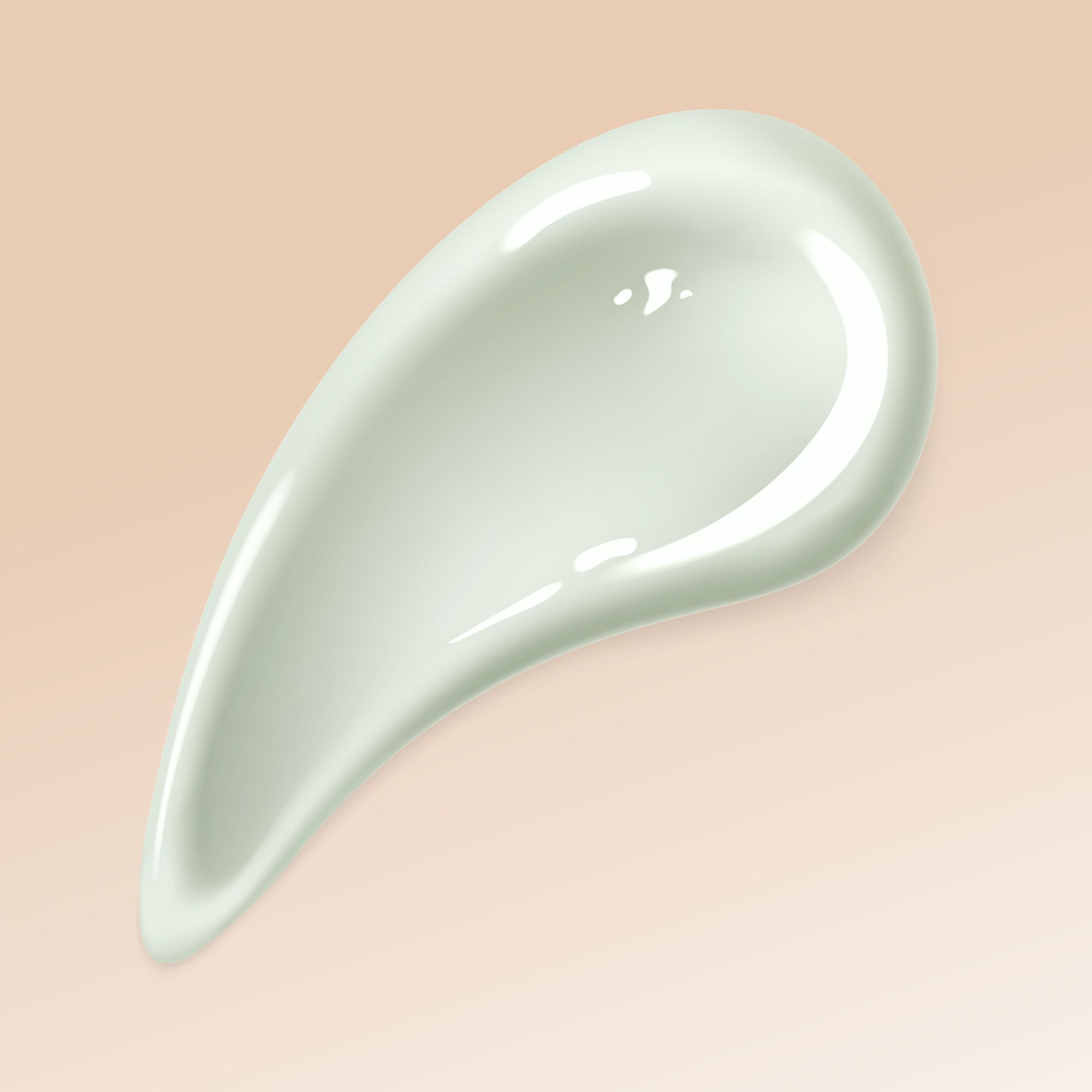 Campione di crema verde chiaro, a forma di goccia, su sfondo beige.