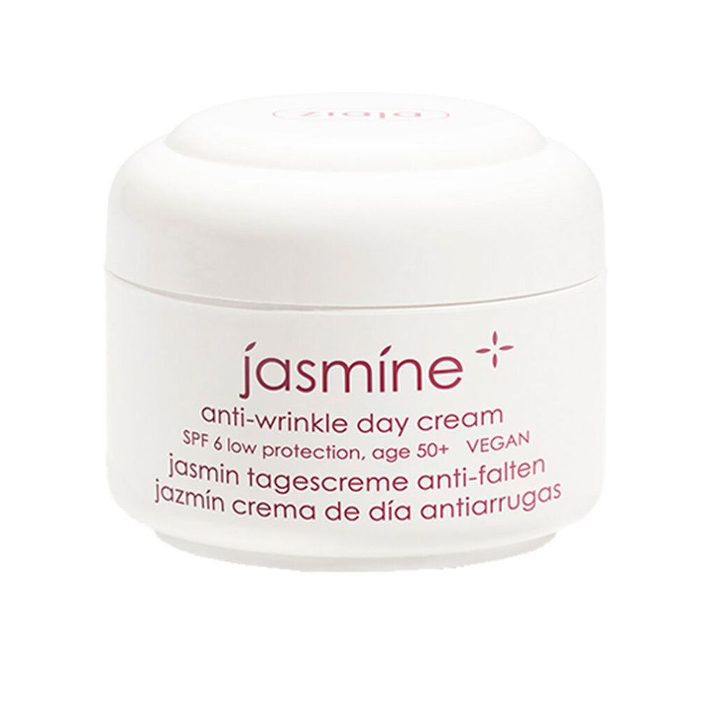 Vasetto bianco con coperchio. Scritta: jasmine, crema giorno antirughe, SPF 6, vegano. Denominazioni multilingue.