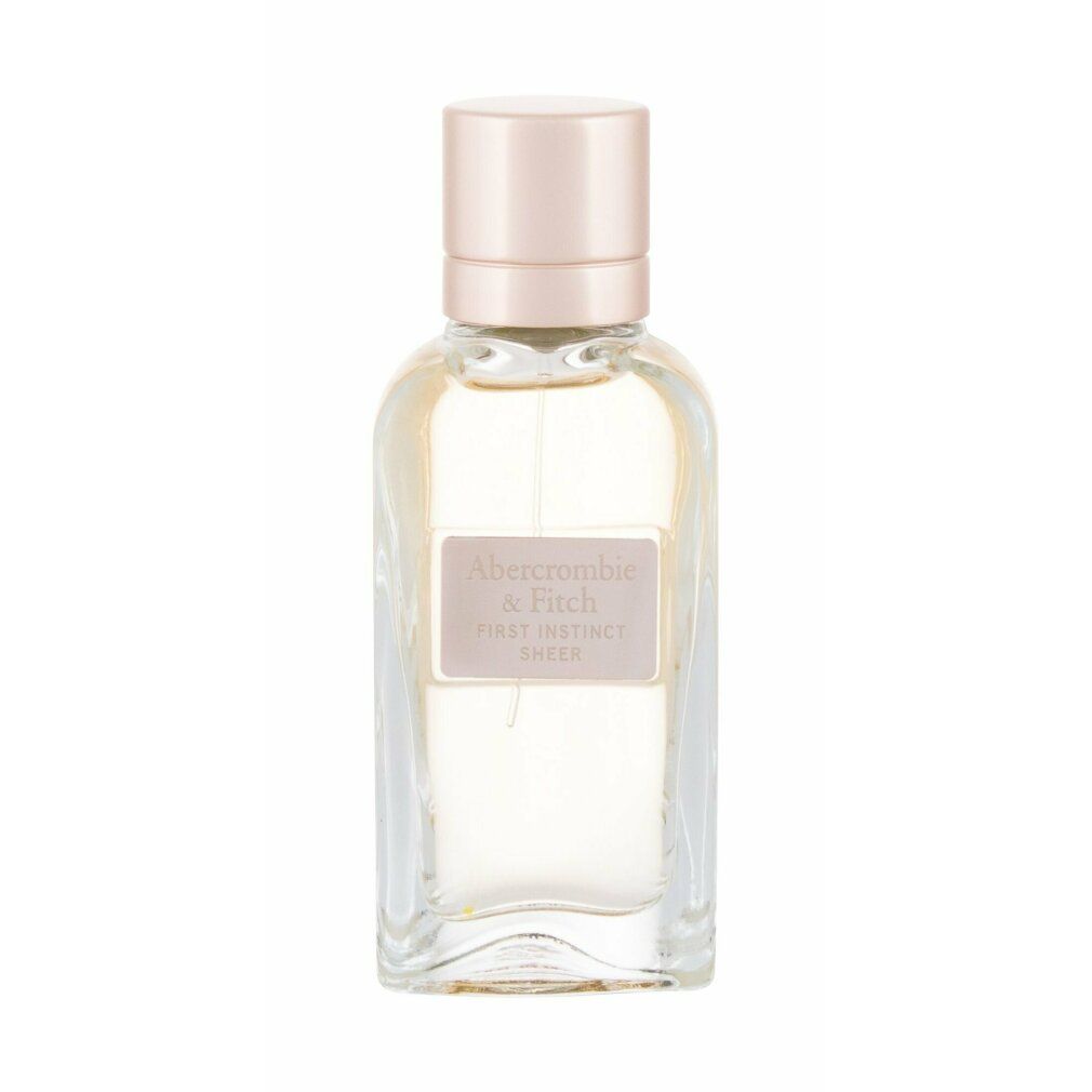 Flacone di profumo con tappo rosa. L'etichetta riporta "Abercrombie & Fitch First Instinct Sheer".