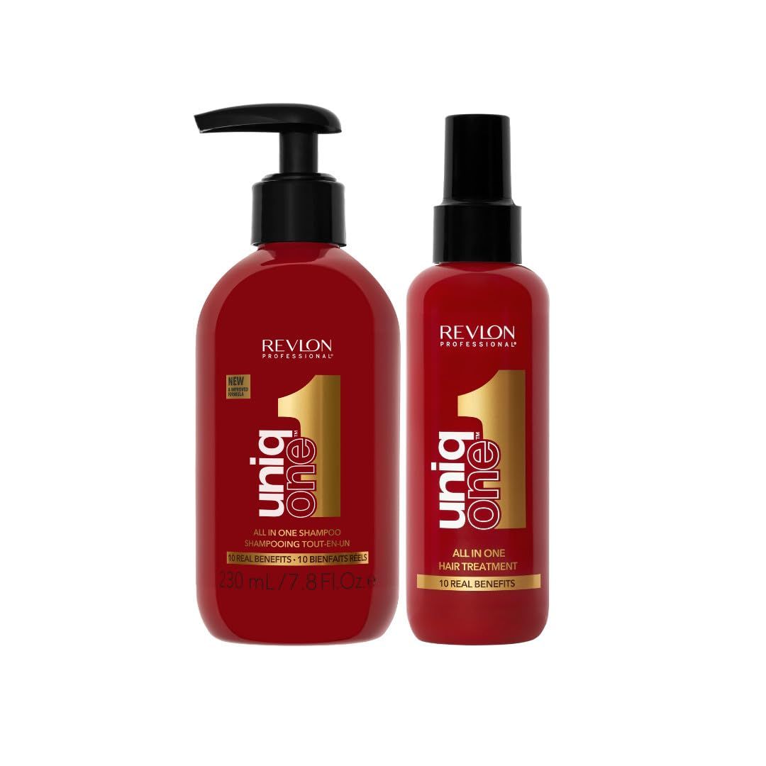 Due flaconi rossi Revlon UniqOne. Shampoo con pompa, trattamento con spray. Scritta dorata.